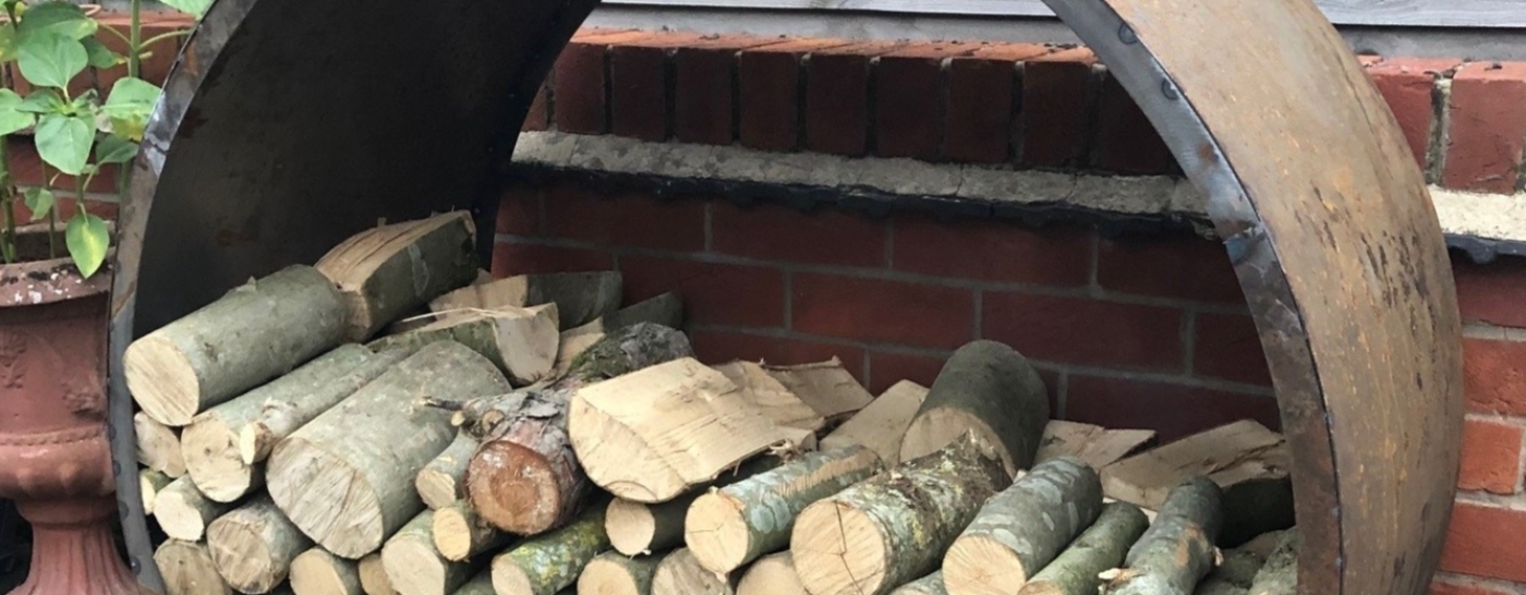 Rusty metal log storage nest