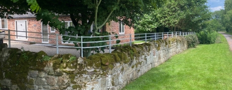 Bespoke fence on top of existing stone wall 